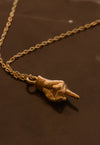 Hand-cast middle finger pendant in gold
